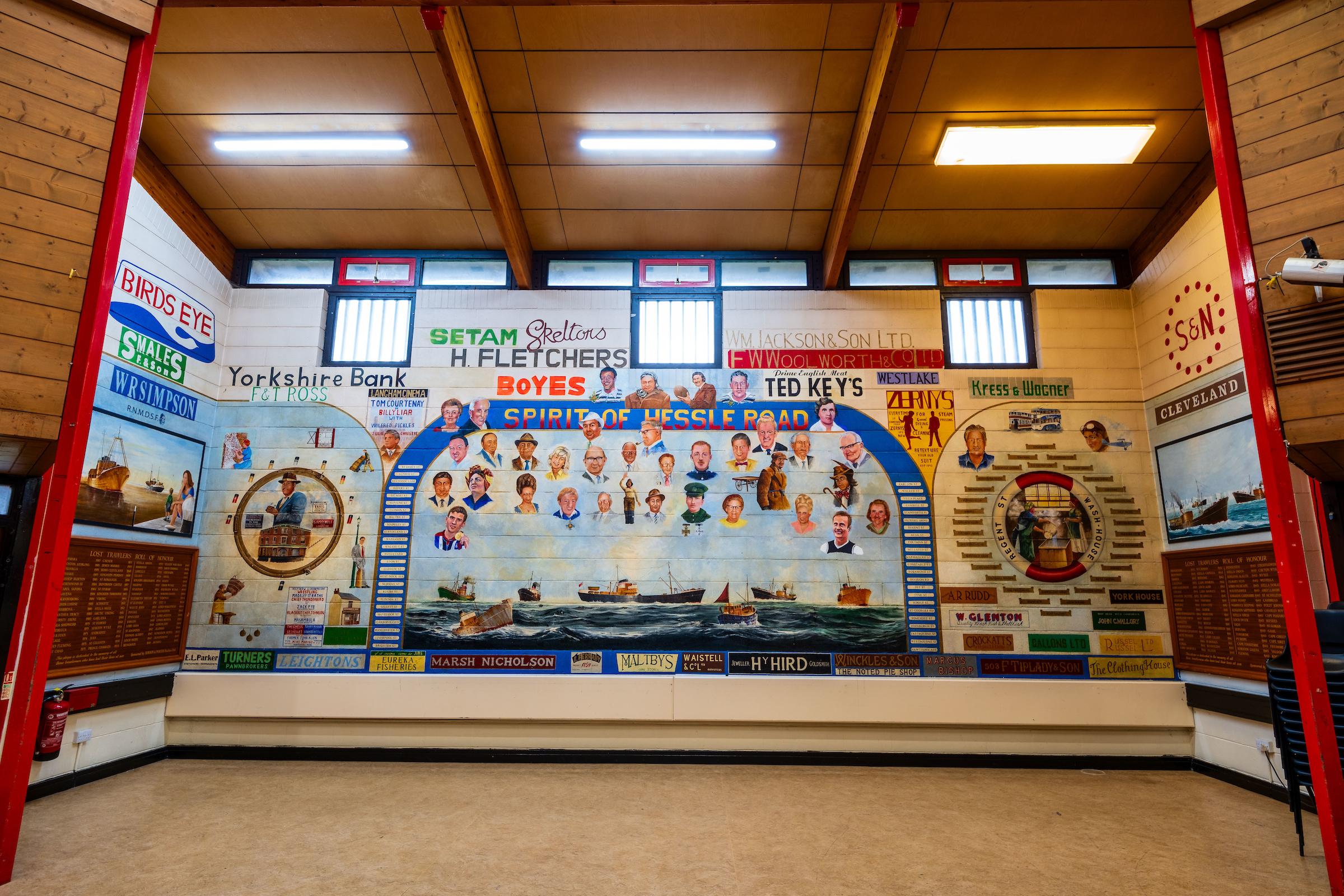 A photograph showing a mural of Hessle Road residents