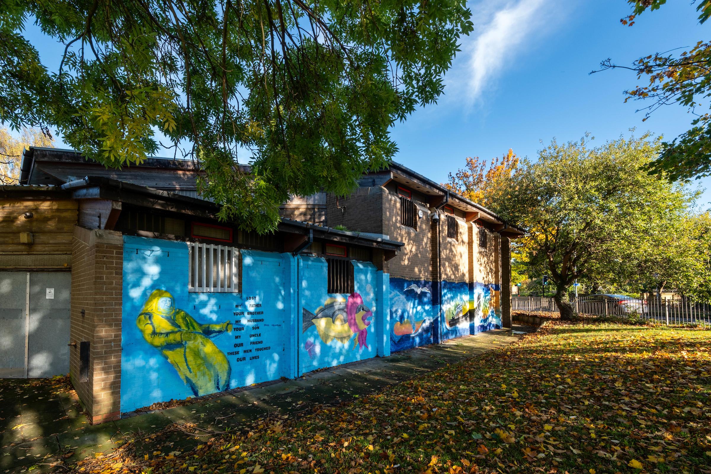 A photograph of a mural on the side of Maurice Rawling community centre honouring Hull's trawlermen.