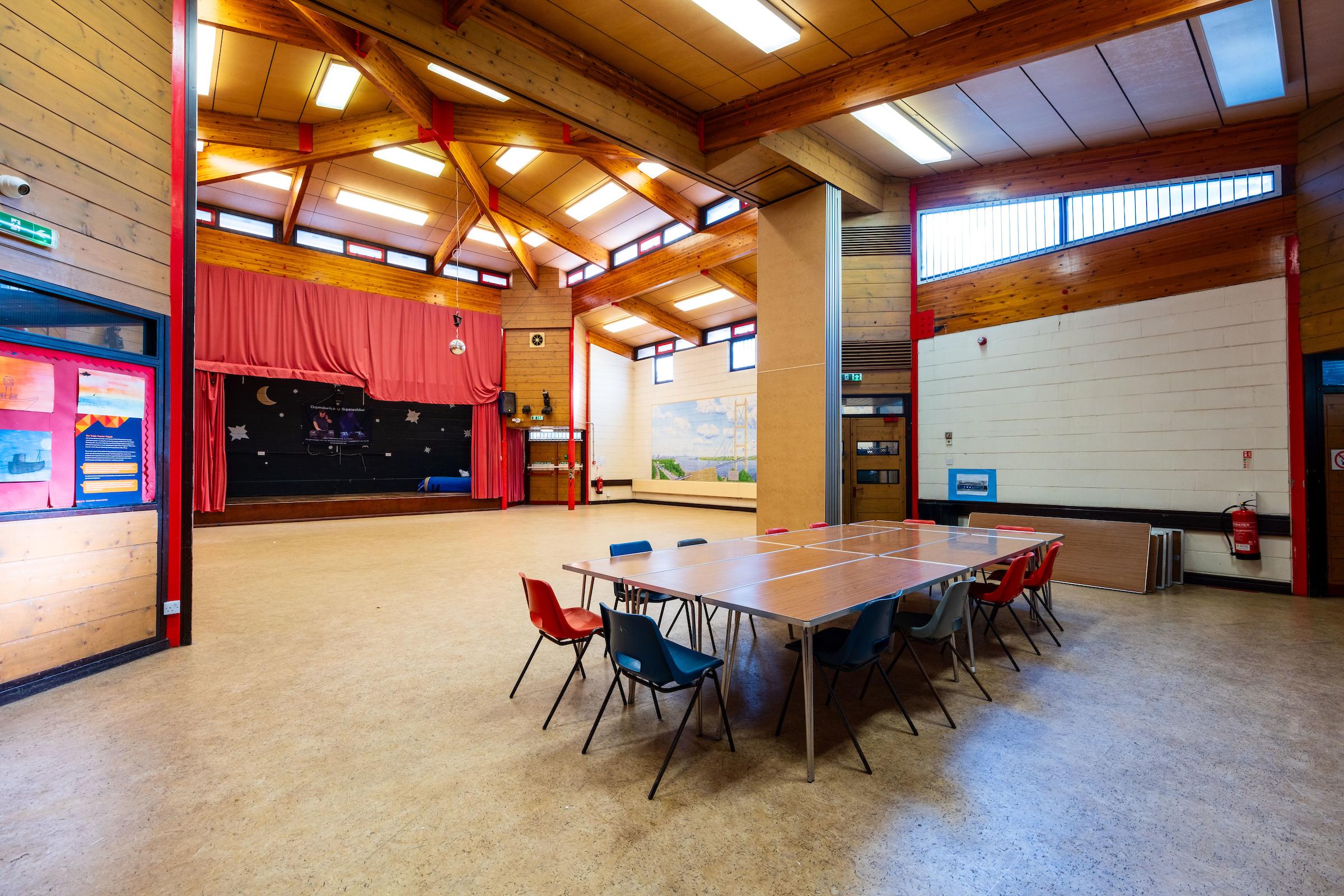 A photograph taken of the hall and stage area at Maurice Rawling community centre